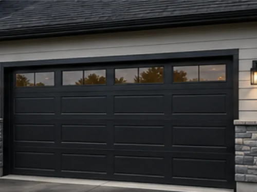 Garage with a black carriage style overhead door, stone columns and exterior coach lighting